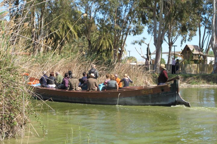 a group of people on a boat in the water