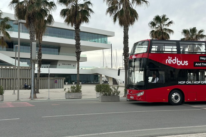 a double decker bus driving down a street