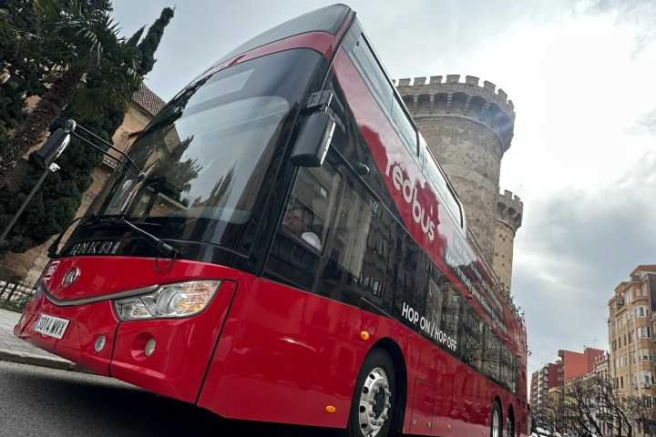 a double decker bus parked on the side of a road