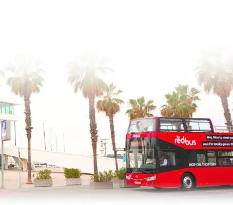 a double decker bus driving down a street